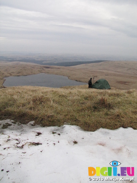 SX13032 Wouko at tent next to snow above Llyn y Fan Fawr lake